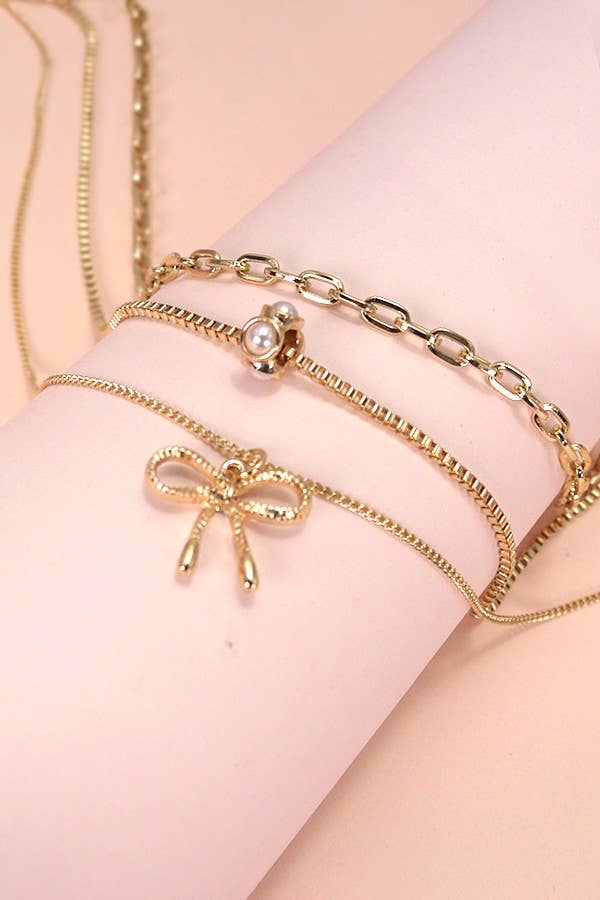PEARL BOW CAHRM NECKLACE