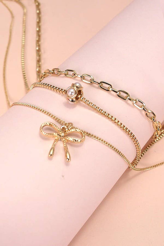 PEARL BOW CAHRM NECKLACE