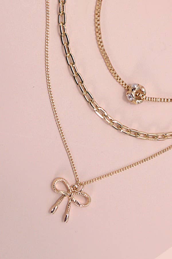 PEARL BOW CAHRM NECKLACE